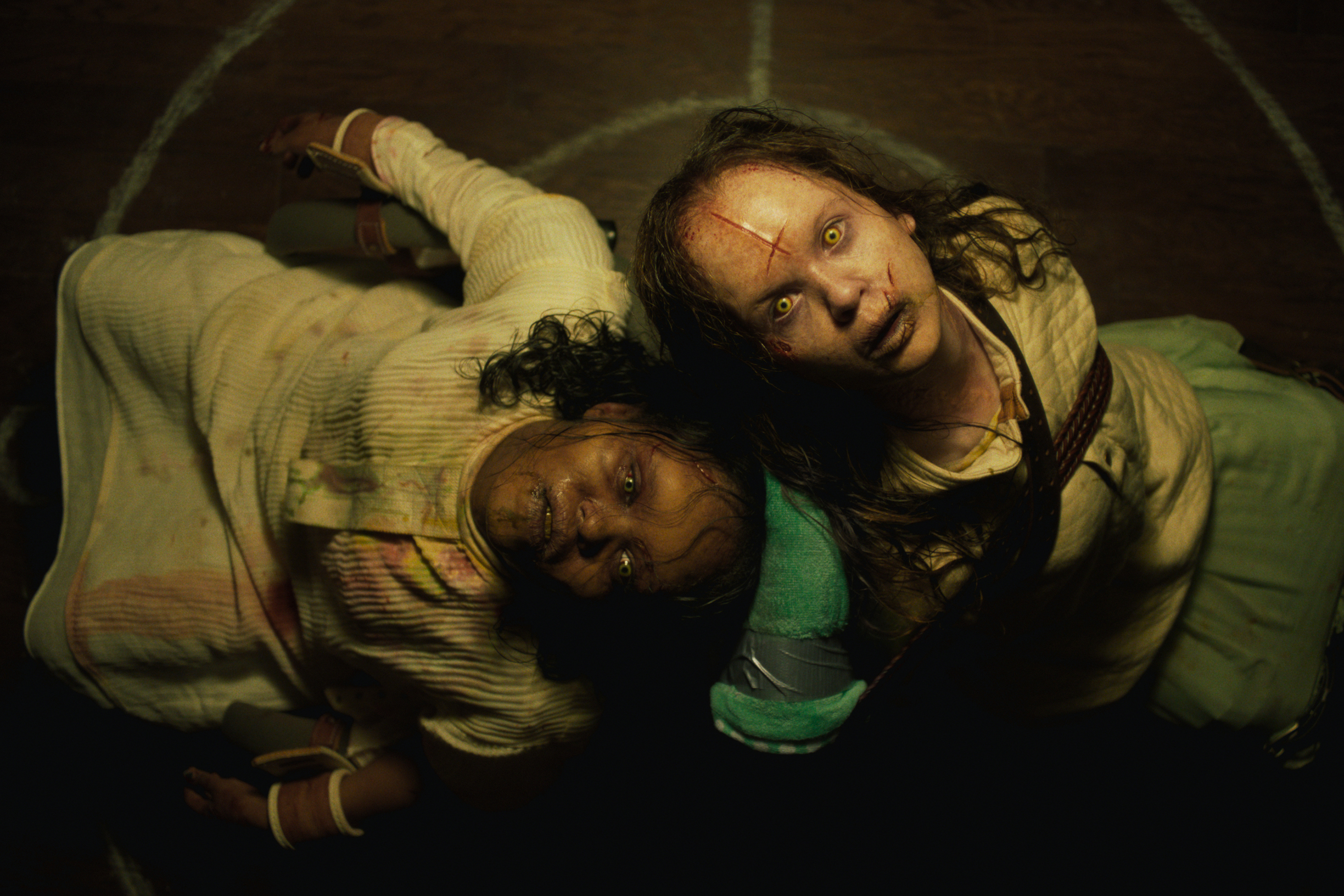 This image released by Universal Pictures shows Lidya Jewett, left, and Olivia O'Neill in a scene from "The Exorcist: Believer." (Universal Pictures via AP)